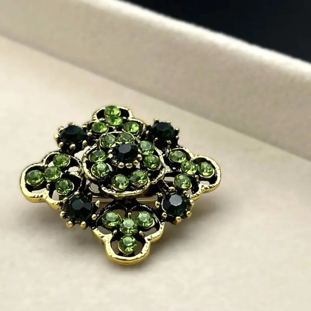 Yellow Gold with Emerald and Peridot Green Crystal Ornate Pin Back Brooch
